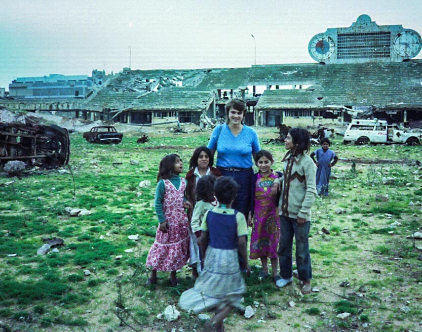 Shirley Elms with Palestinian refugee children inside the stadium adjacent to the Sabra and Shatila refugee camps (October 1983).