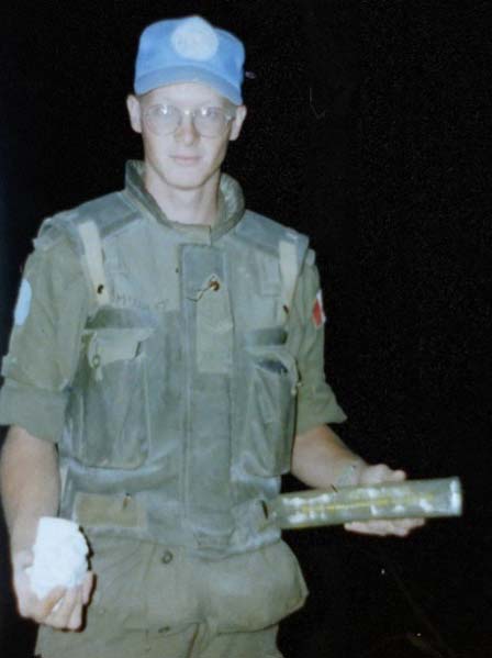 Sapper Bill McAuley prepares C4 explosives charges for nighttime rock blasting on main supply route PACMAN between Blinje to Kresevo. 14 September 1994. Engineer work occurred from 2000-0530 hrs to allow vital humanitarian convoy traffic to use PACMAN during daylight hours.